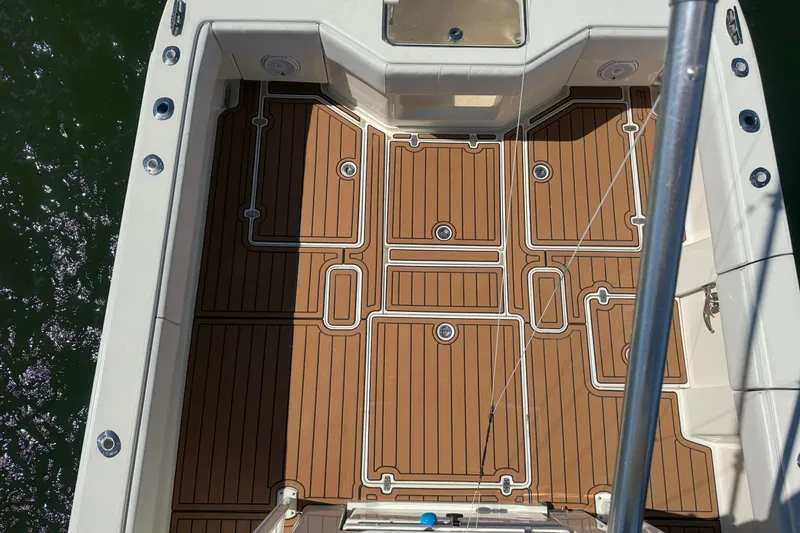 Slide: The Image of 2018 SeaVee 390Z boat deck with teak-style flooring, viewed from above. - 36