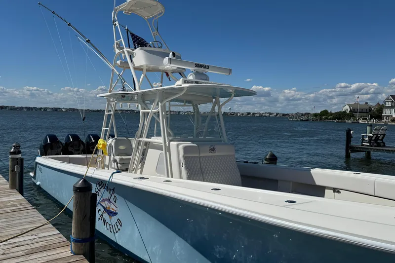 Slide: The Image of 2018 SeaVee 390Z boat docked by the water on a sunny day. - 45