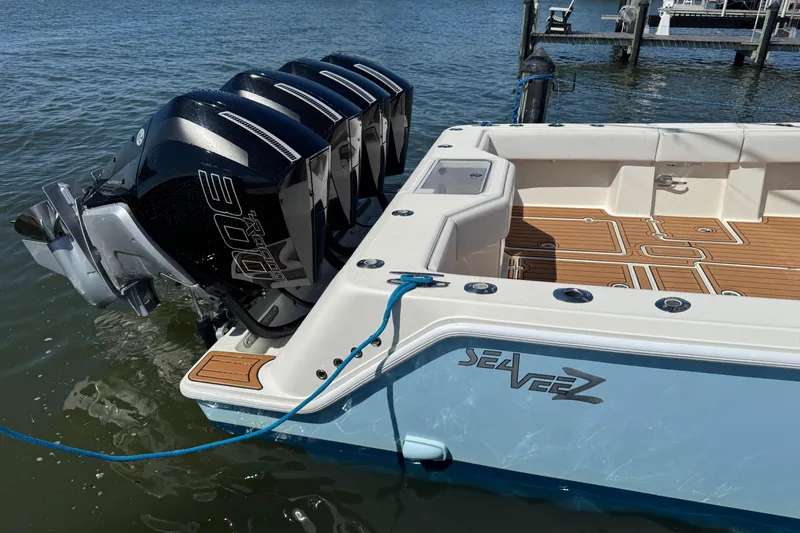 Slide: The Image of 2018 SeaVee 390Z boat with quad engines docked on water. - 48