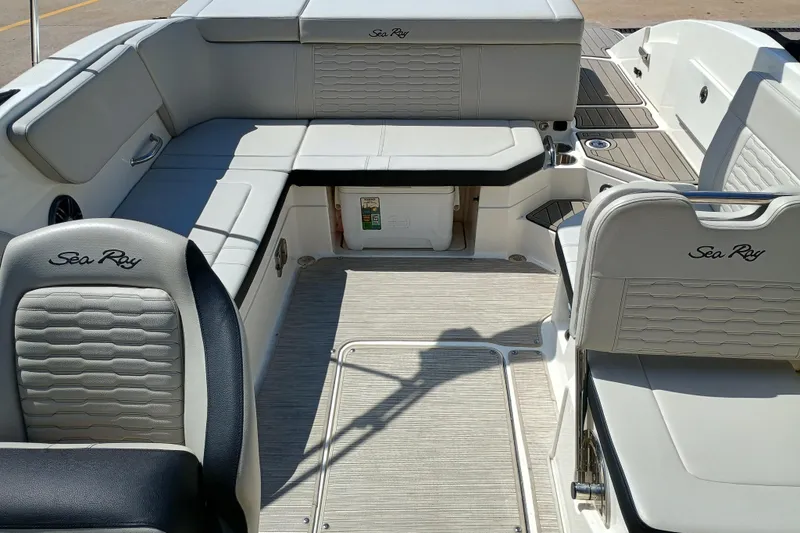 Slide: The Image of 2022 Sea Ray SPX 230 boat interior with luxurious seating and modern design. - 2