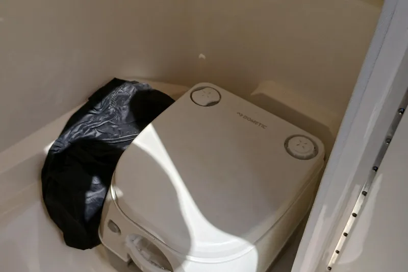 Slide: The Image of Portable toilet in 2022 Sea Ray SPX 230 boat bathroom. - 6