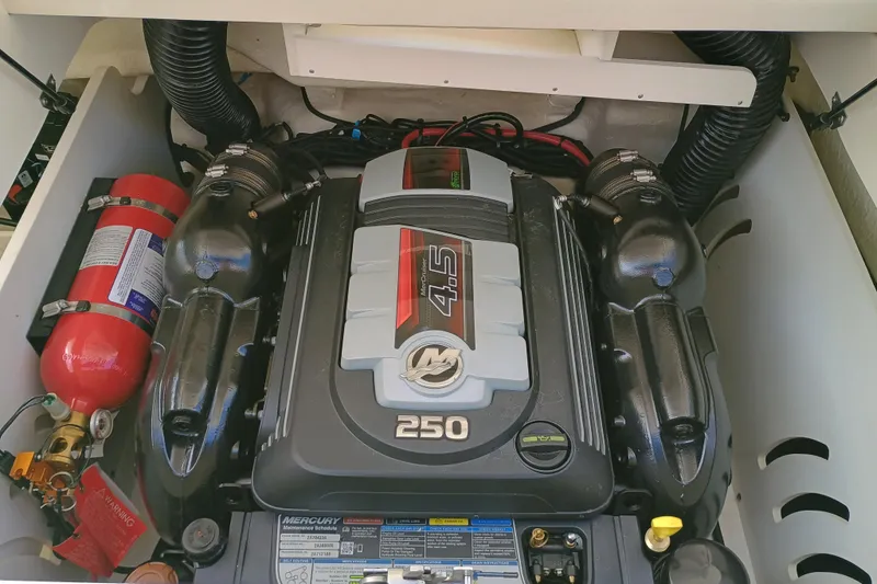 Slide: The Image of Engine compartment of 2022 Sea Ray SPX 230 with Mercury 4.5L 250 HP engine. - 7