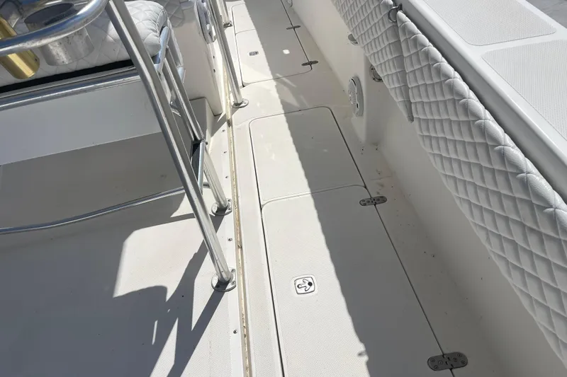 Slide: The Image of 2002 Fountain 38 CC Tournament Edition boat deck with quilted seating and metal railings. - 20