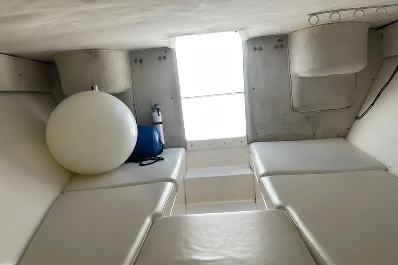 Slide: The Image of Interior cabin of 2002 Fountain 38 CC Tournament Edition boat with seating and equipment. - 26