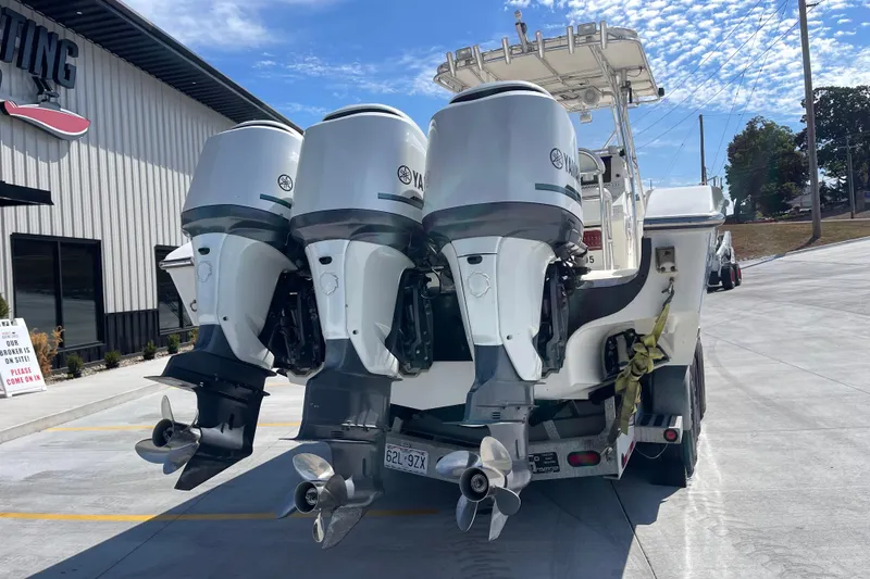 Slide: The Image of 2002 Fountain 38 CC Tournament Edition boat with triple Yamaha outboard engines. - 5