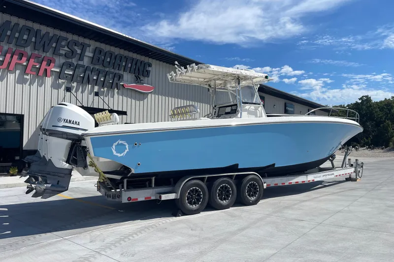 Slide: The Image of 2002 Fountain 38 CC Tournament Edition boat on trailer at Midwest Boating Center. - 7