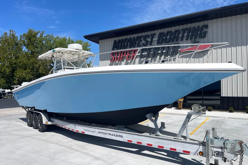Slide: The Image of 2002 Fountain 38 CC Tournament Edition boat on trailer at Midwest Boating Super Center. - 8