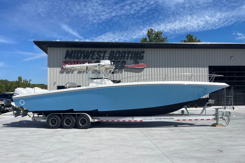 Slide: The Image of 2002 Fountain 38 CC Tournament Edition boat on trailer at Midwest Boating Superstore. - 9