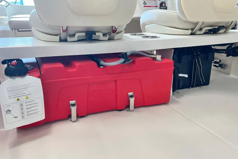 Slide: The Image of 2026 Boston Whaler 160 Super Sport interior with red fuel tank under seats. - 9