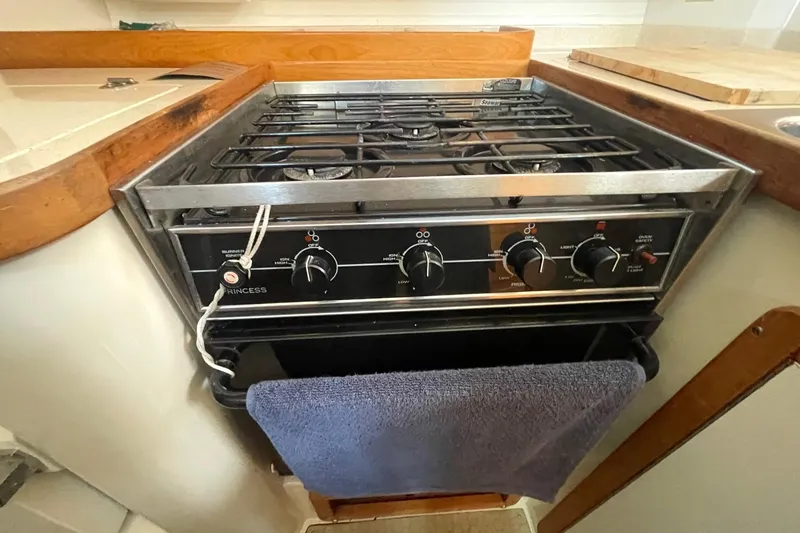 Slide: The Image of Gas stove in 2001 Catalina 42 yacht kitchen with towel hanging. - 11