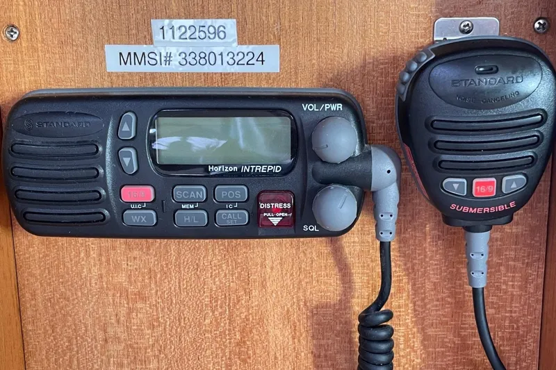 Slide: The Image of Marine radio equipment on a 2001 Catalina 42 sailboat, featuring Standard Horizon Intrepid. - 13