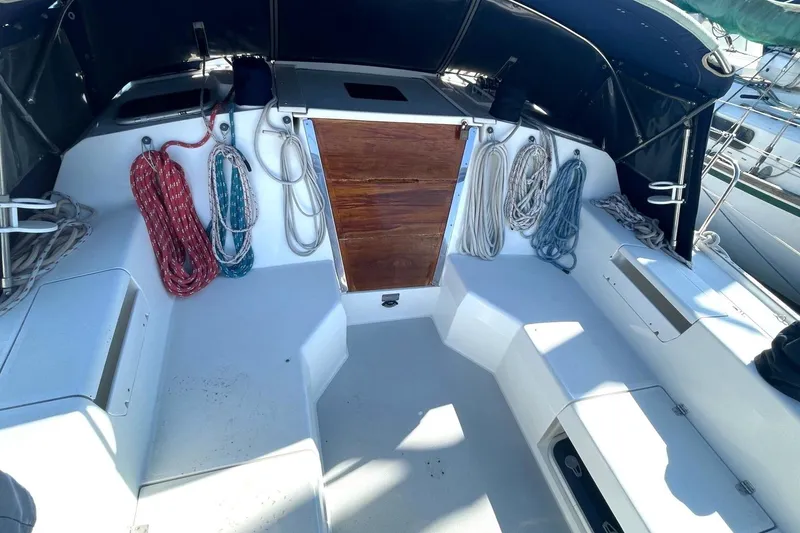 Slide: The Image of Cockpit of 2001 Catalina 42 sailboat with ropes and wooden hatch. - 24
