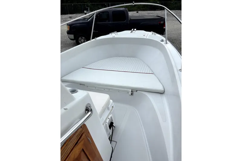 Slide: The Image of 1996 Boston Whaler 21 Outrage boat interior with seating and railing. - 9