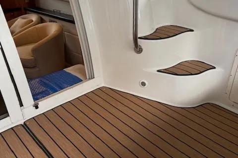 Slide: The Image of 2002 Regal Commodore 3880 yacht interior with wooden flooring and curved steps. - 15