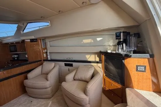 Slide: The Image of Interior of 2002 Regal Commodore 3880 yacht with cozy seating and modern amenities. - 24