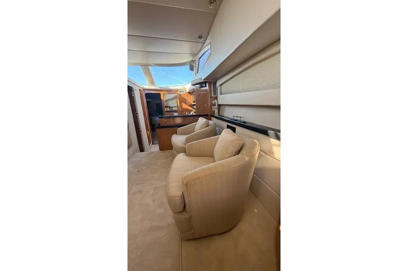 Slide: The Image of Interior of 2002 Regal Commodore 3880 yacht with plush seating and elegant design. - 25