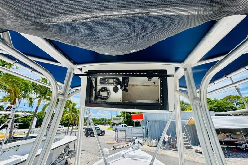 Slide: The Image of 2006 Sea Pro SV2100 CC boat console with canopy, featuring navigation equipment. - 5