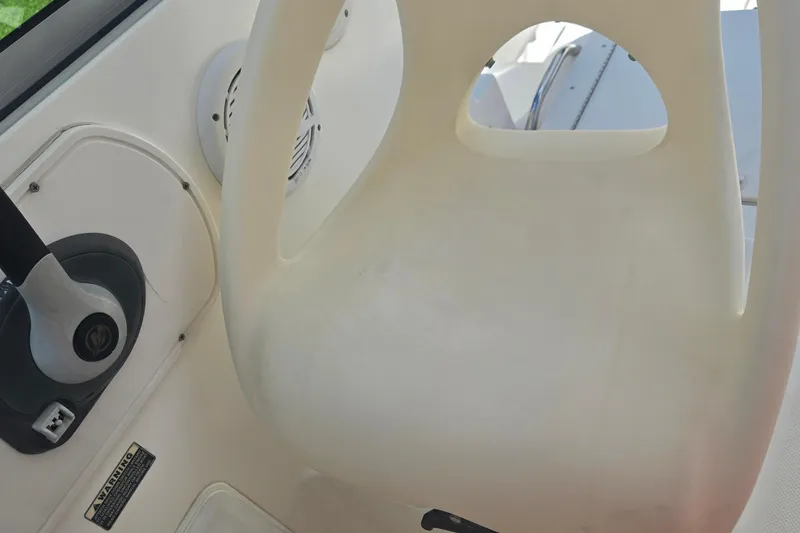 Slide: The Image of 2005 Trophy Sportfishing boat interior with steering wheel and seat detail. - 13