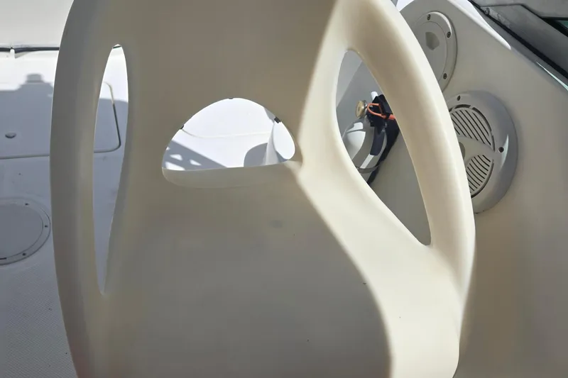 Slide: The Image of 2005 Trophy Sportfishing boat interior with white seat and speaker detail. - 14