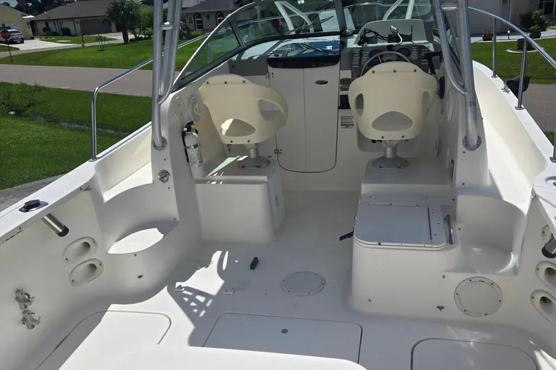 Slide: The Image of 2005 Trophy Sportfishing boat interior with seating and control panel. - 15