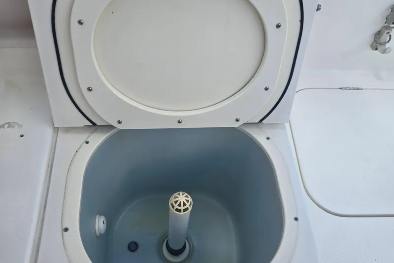 Slide: The Image of Open livewell on a 2005 Trophy Sportfishing boat, showcasing interior details. - 19