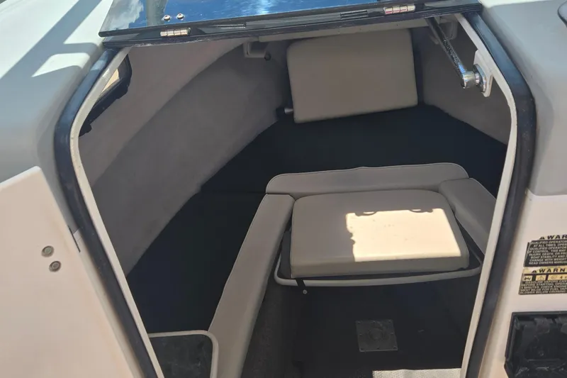 Slide: The Image of 2005 Trophy Sportfishing boat cabin interior with cushioned seating. - 24