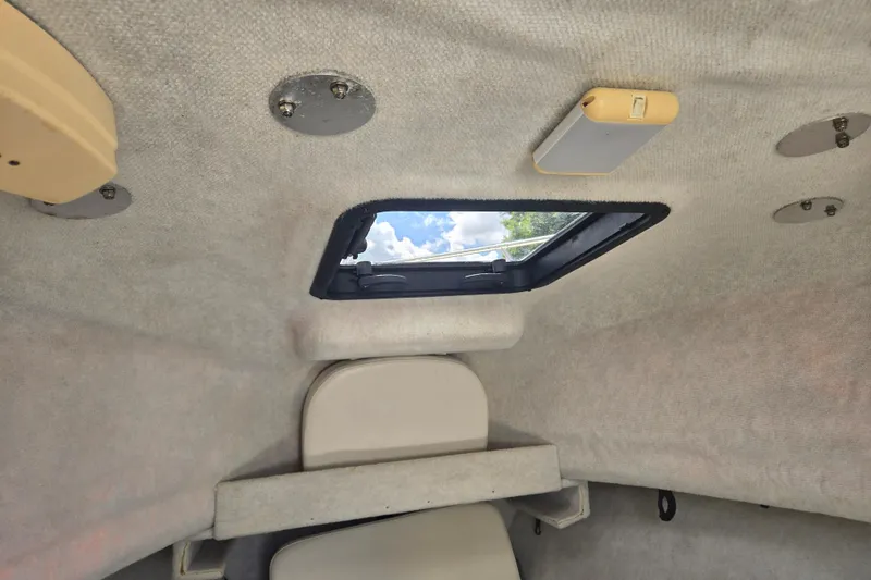 Slide: The Image of Interior cabin view of a 2005 Trophy Sportfishing boat with a skylight. - 26