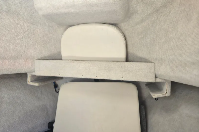 Slide: The Image of 2005 Trophy Sportfishing boat interior with cushioned seating and carpeted surfaces. - 28