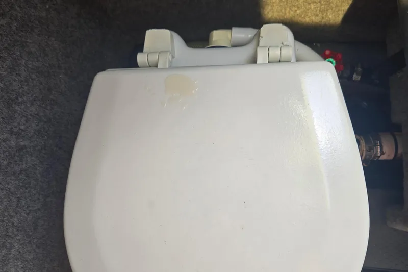 Slide: The Image of Boat toilet seat in a 2005 Trophy Sportfishing vessel interior. - 30