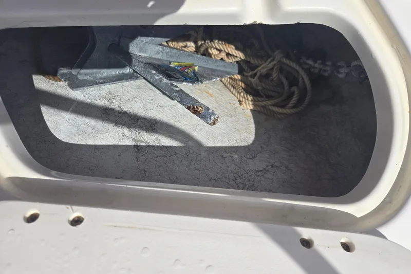 Slide: The Image of Anchor and rope storage in 2005 Trophy Sportfishing boat compartment. - 31