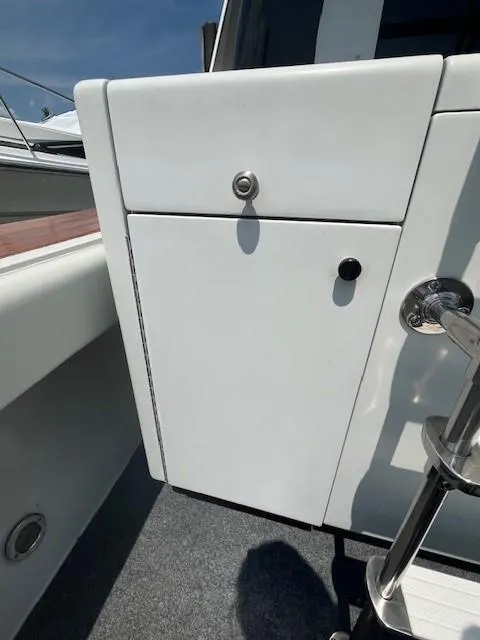 Slide: The Image of 1987 Trojan 10.8 Meter Sedan boat exterior storage compartment. - 15