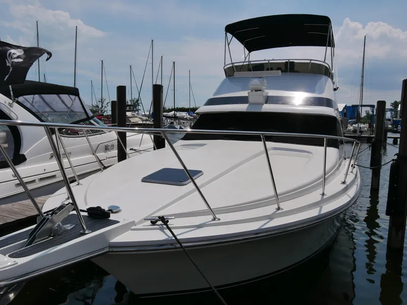 Slide: The Image of 1987 Trojan 10.8 Meter Sedan boat docked at a marina. - 3