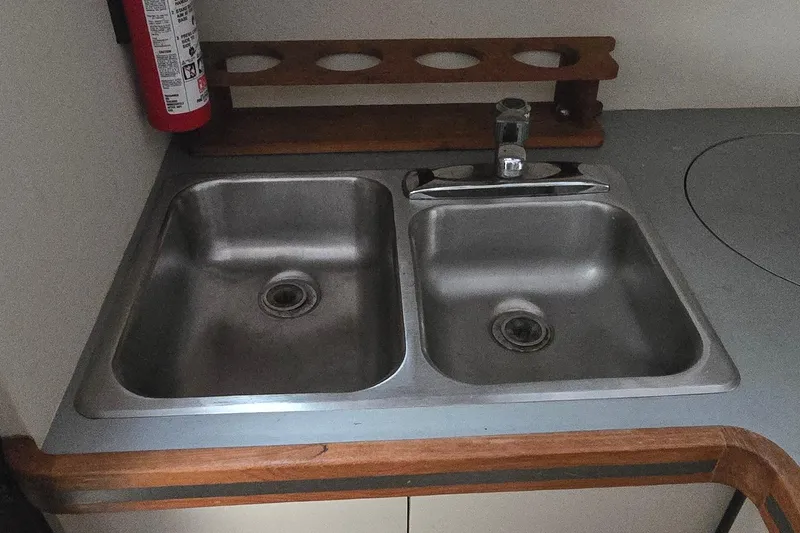 Slide: The Image of Double stainless steel sink in 1987 Trojan 10.8 Meter Sedan boat kitchen. - 30