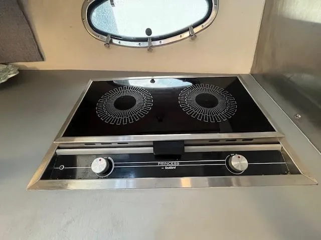 Slide: The Image of 1987 Trojan 10.8 Meter Sedan boat kitchen with a two-burner electric stove. - 32