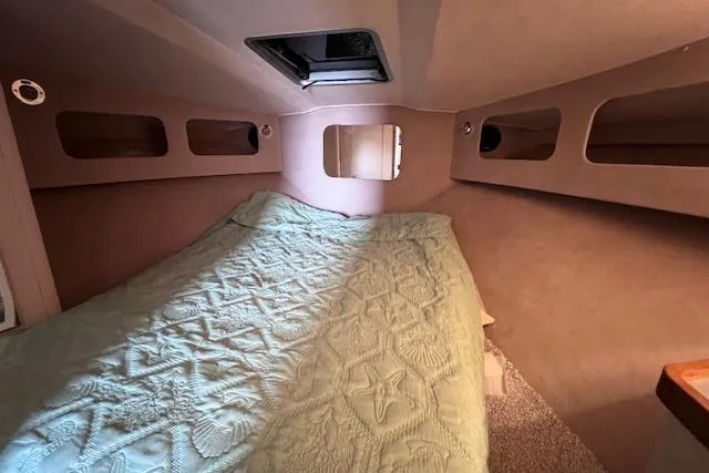 Slide: The Image of Interior cabin of a 1987 Trojan 10.8 Meter Sedan with a cozy bed. - 37