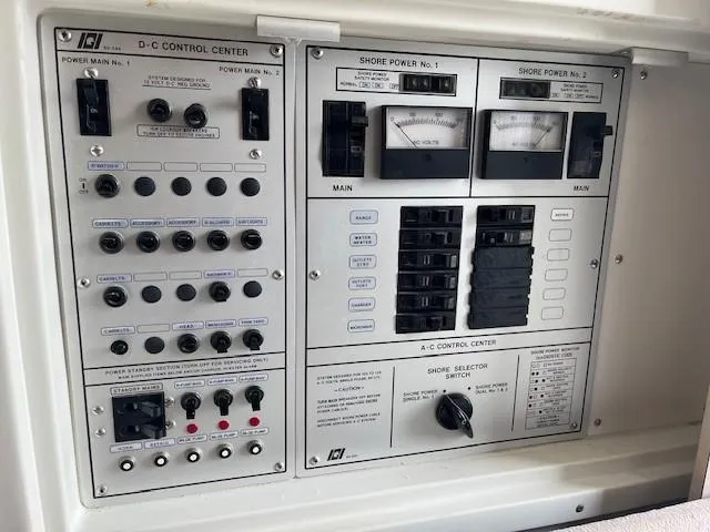 Slide: The Image of 1987 Trojan 10.8 Meter Sedan control panel with DC and AC power switches. - 41