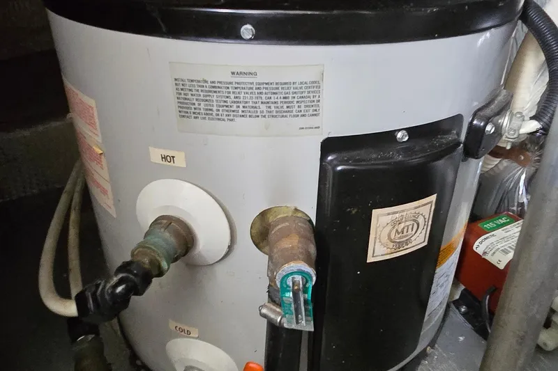 Slide: The Image of 1987 Trojan 10.8 Meter Sedan boat water heater with hot and cold connections. - 44