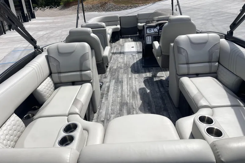 Slide: The Image of Luxurious interior of 2020 Crest 250 Caribbean pontoon boat with plush seating and cup holders. - 15