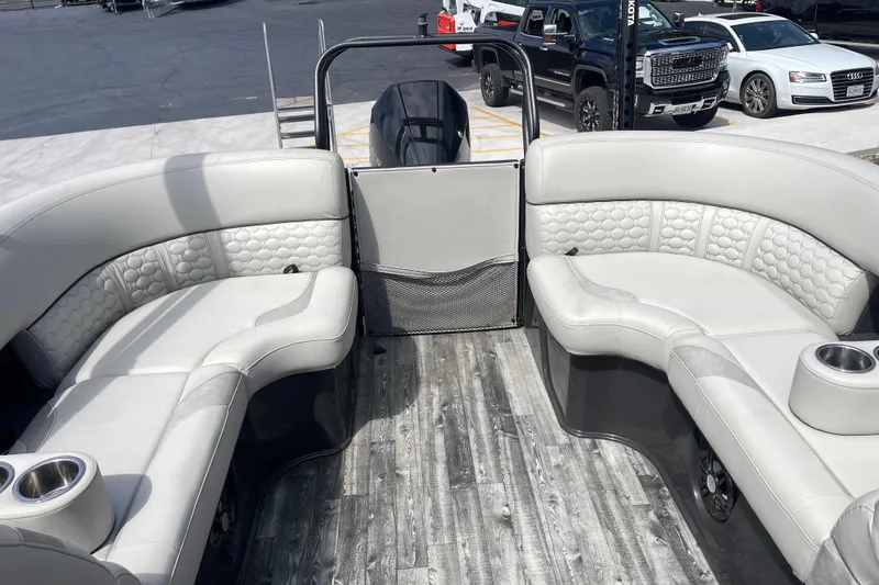 Slide: The Image of 2020 Crest 250 Caribbean boat interior with plush seating and modern design. - 17