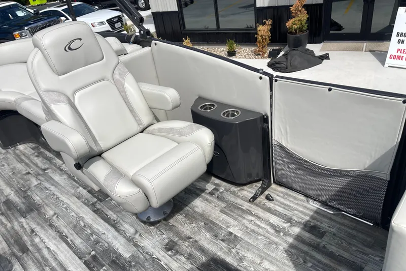 Slide: The Image of Luxurious seating on 2020 Crest 250 Caribbean boat with cup holders and stylish flooring. - 22