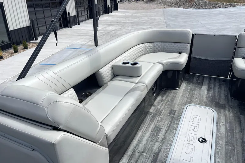 Slide: The Image of 2020 Crest 250 Caribbean boat interior with luxurious seating and modern flooring. - 26