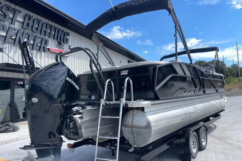 Slide: The Image of 2020 Crest 250 Caribbean pontoon boat with Mercury engine at a boating center. - 3
