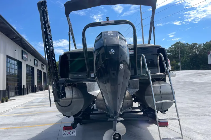 Slide: The Image of 2020 Crest 250 Caribbean boat with outboard motor in a parking lot. - 5