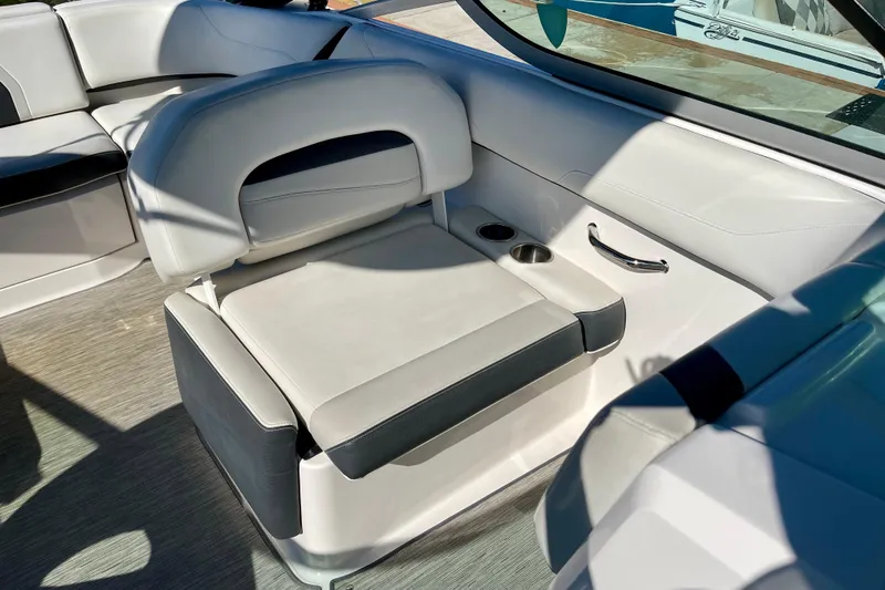 Slide: The Image of Interior seating of 2016 Regal 23 OBX boat with cup holders and sleek design. - 24