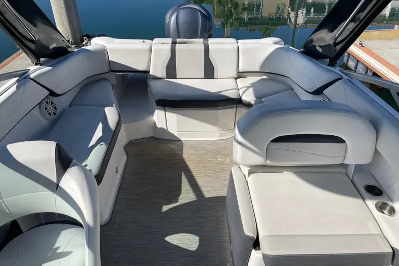 Slide: The Image of 2016 Regal 23 OBX boat interior with white seating and modern design. - 25