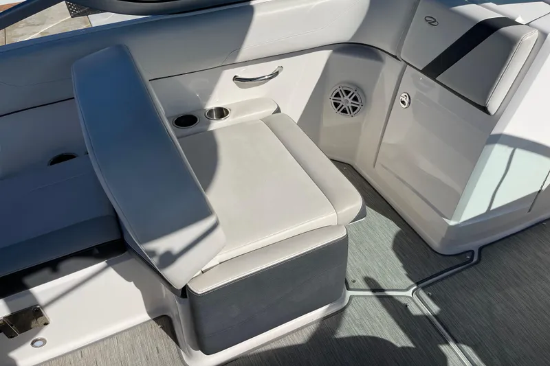 Slide: The Image of 2016 Regal 23 OBX boat interior with cushioned seating and cup holders. - 30