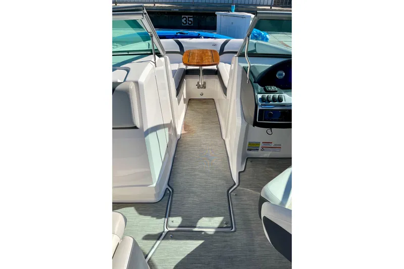Slide: The Image of 2016 Regal 23 OBX boat interior with seating and control panel. - 37