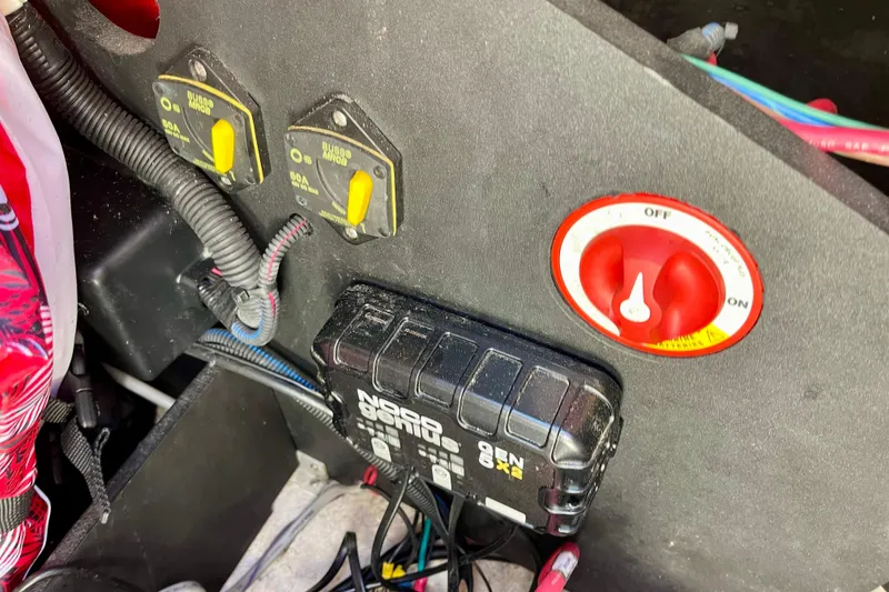 Slide: The Image of Electrical panel of a 2016 Regal 23 OBX boat with switches and wiring. - 52