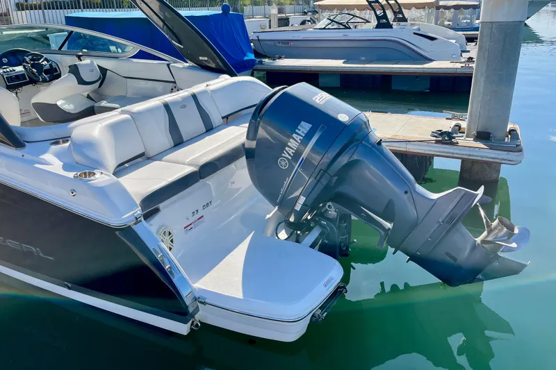 Slide: The Image of 2016 Regal 23 OBX boat with Yamaha outboard motor docked in marina. - 9