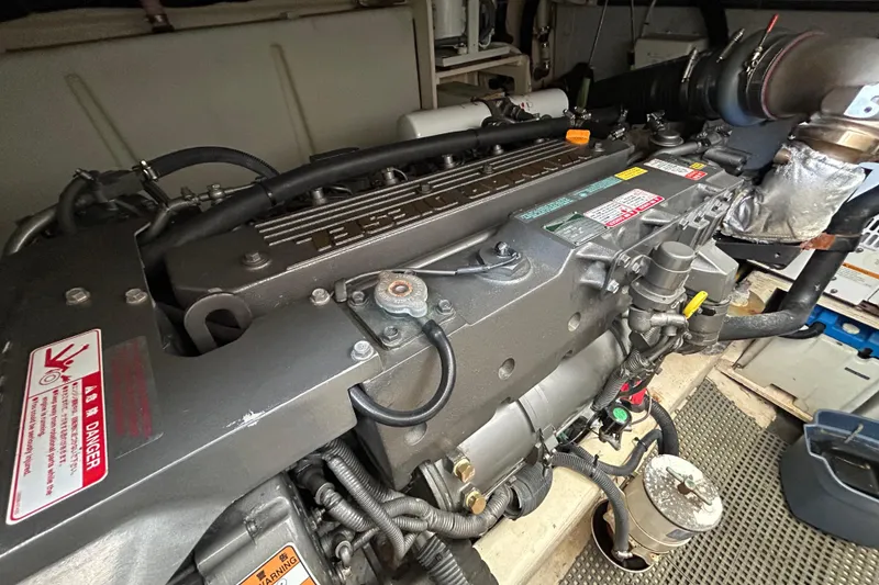 Slide: The Image of Engine of a 2005 Sabre 38 boat, showcasing detailed mechanical components. - 17